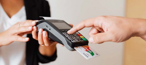Person using a credit card reader for a purchase